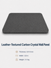 Charcoal gray leather-textured carbon crystal wall panel shown in an angled view with a black-gray composite core.